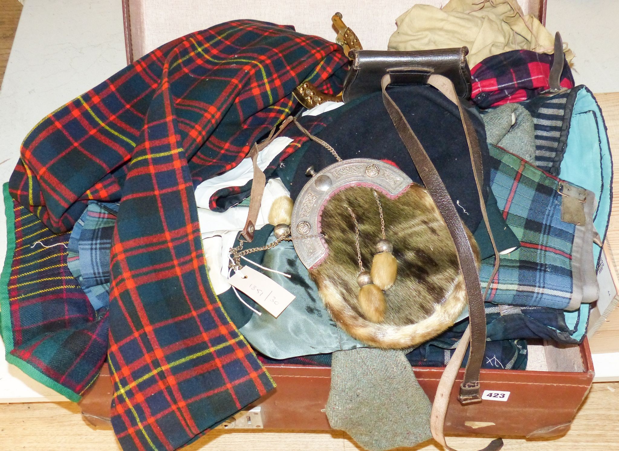 A group of early 20th century men’s and women’s tartan clothing, a electroplate mounted sporran etc.